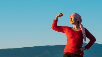 Woman posing strongly outside image