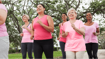 Group of women running outdoors wearing sportswear image