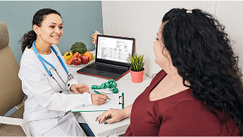 Healthcare professional and patient sat down talking during a consultation image