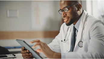 Healthcare profeesional using a tablet image