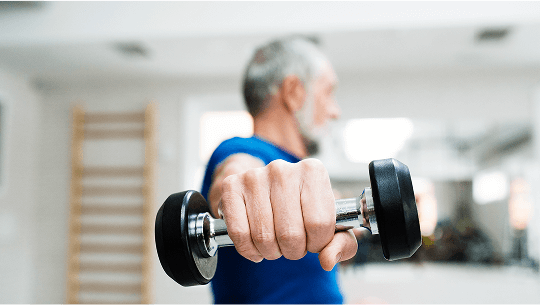 Older man lifting a dumbell image