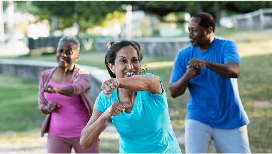Group of people outside doing a boxing-based exercise class image