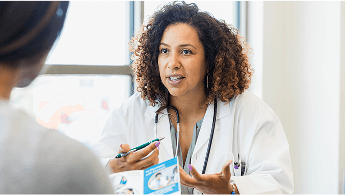 Healthcare professional talking to a patient image