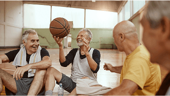 Older men sat down on a basketball court image