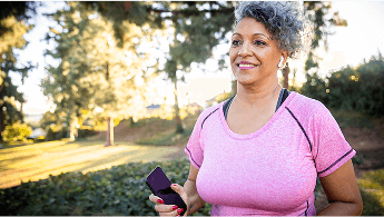 Woman outside in sports wear image