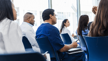 Healthcare professionals sat down in a seminar image