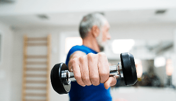 Older man lifting a dumbell image
