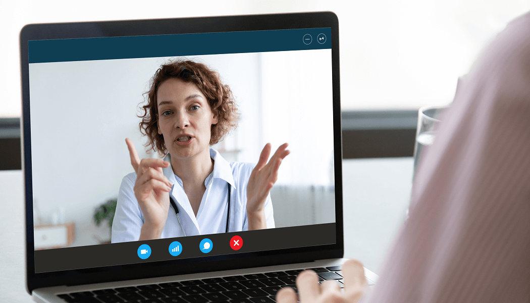 Healthcare professional on a laptop screen during a video call image