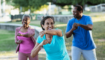 Group of people outside doing a boxing-based exercise class image