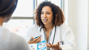 Healthcare professional talking to a patient image