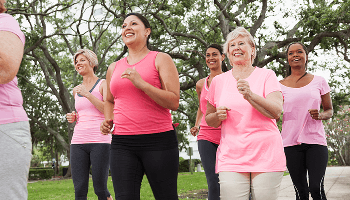 Group of women running outdoors wearing sportswear image