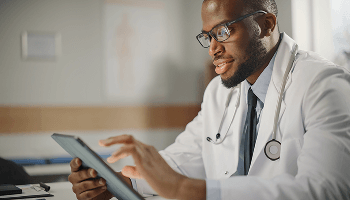 Healthcare profeesional using a tablet image