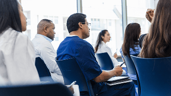 Healthcare professionals sat down in a seminar image