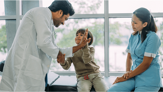 Child giving a healthcare professional a high-five image